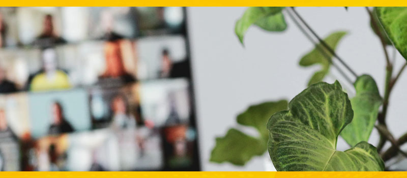 promotional image that represents business transformation - photograph of office with zoom meeting and customer training and coaching